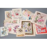 A collection of postcards and greetings cards