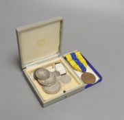 A group of silver medallions and silver coins including two crowns