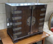 A Korean brass mounted pine table cabinet fitted with an arrangement of drawers, width 70cm, depth
