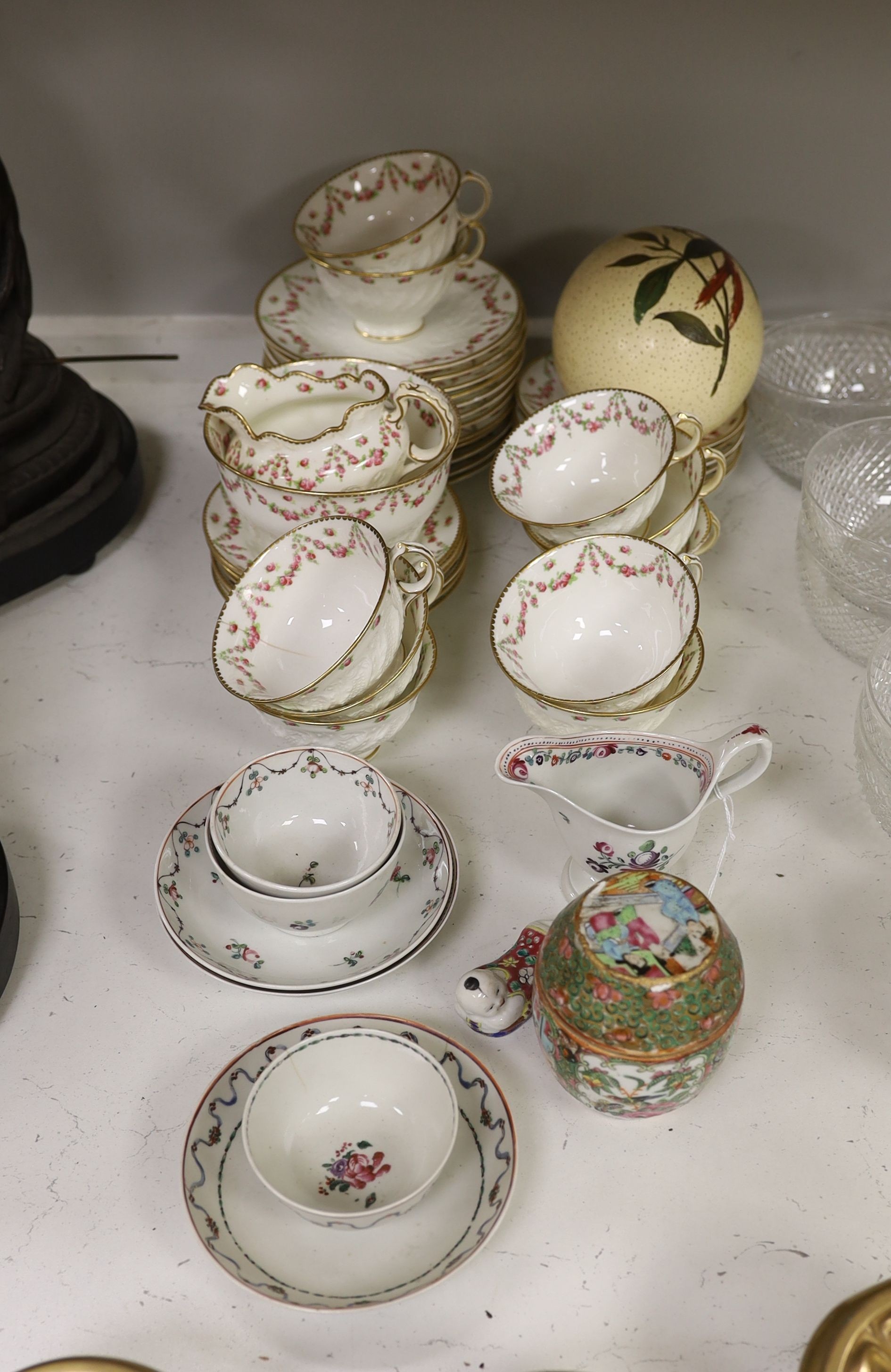 A Chinese famille rose pot and cover, a part Crescent China tea set and a small quantity of tea