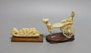 A Japanese ivory rickshaw group and a walrus ivory okimono of three immortals and attendants in a