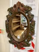 A Victorian style oval polychrome carved wood mirror width 50cm, height 78cm