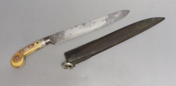An African Arab knife, 19th century, carved ivory handle with silver inlays, leather covered wood