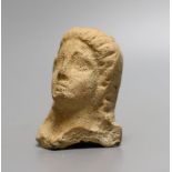 An antiquity terracotta figure head,8cms high.