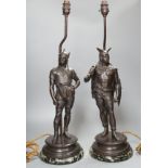 A pair of spelter warrior lamps on marbled plinth base - 62cm high