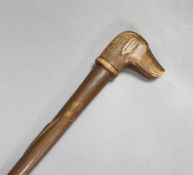 A Folk art carved dog-head walking cane - 92.5cm