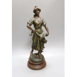 After Sylvain Kinsburger, an early 20th century French painted spelter statuette ‘Glaneuse’ 51cm