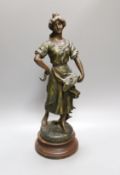 After Sylvain Kinsburger, an early 20th century French painted spelter statuette ‘Glaneuse’ 51cm