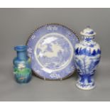 An early 20th century Chinese blue and white lidded vase together with a similar enamelled pottery