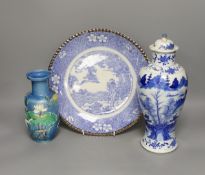 An early 20th century Chinese blue and white lidded vase together with a similar enamelled pottery