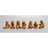 A group of seven terracotta figures of playful youths
