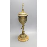 A decorative Bacchus electrotype chalice and cover on stone base - 49cm high