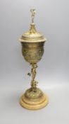 A decorative Bacchus electrotype chalice and cover on stone base - 49cm high