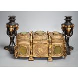 A French gilt metal casket inset with reverse painted glass panels and a pair of ormolu style