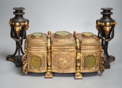 A French gilt metal casket inset with reverse painted glass panels and a pair of ormolu style