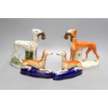 Two Staffordshire greyhounds and a pair of recumbent Staffordshire ‘greyhound’ desk stands.