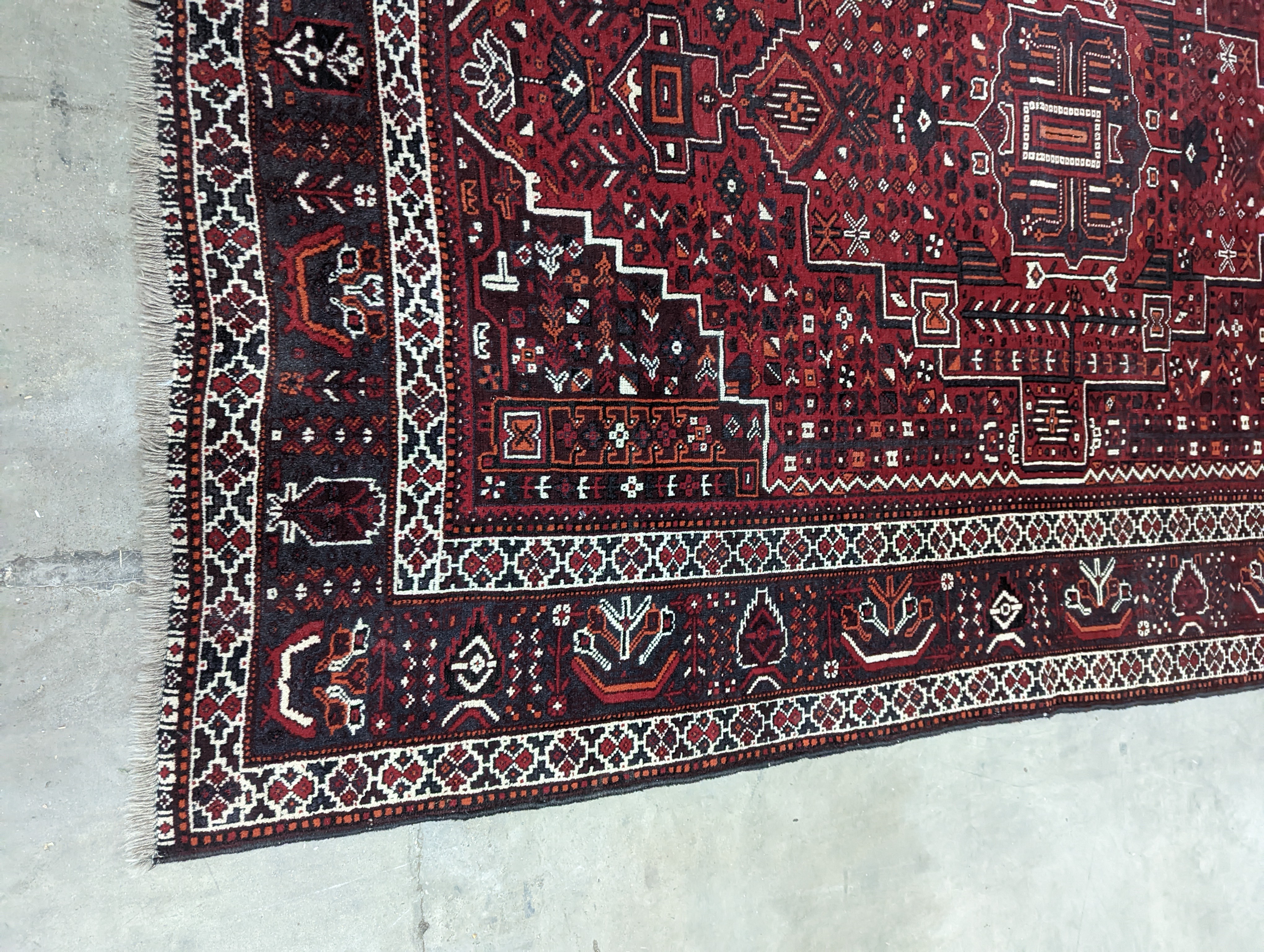 A Caucasian design burgundy ground carpet, 280 x 210cm - Image 8 of 12