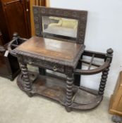 A late Victorian carved oak hall stand with mirror, width 125cm