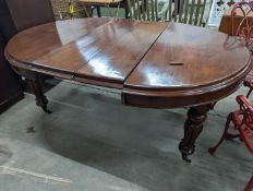 A Victorian mahogany extending dining table, length 170cm extended (two spare leaves), width