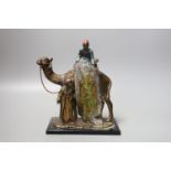 A cold painted metal ‘rug sellers and camel’ table lighter in Bergman style 19cm