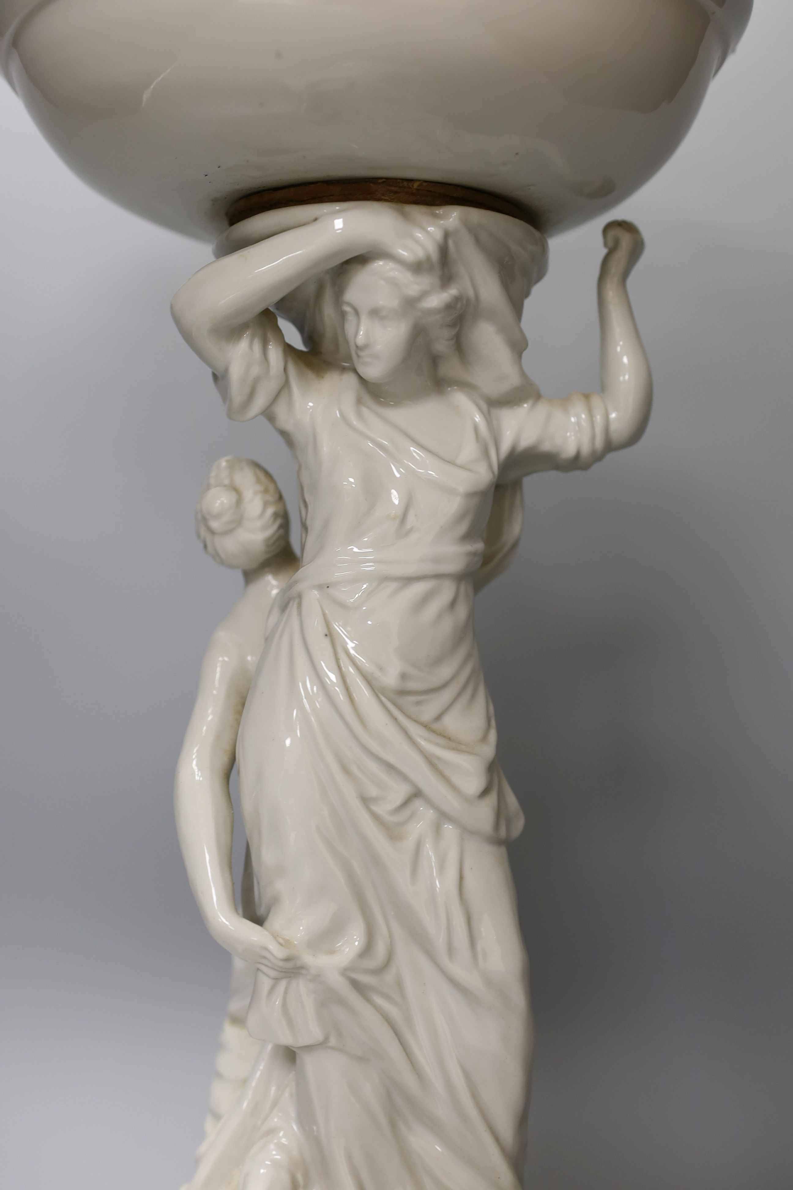 A Continental white glazed porcelain centrepiece bowl modelled with two maidens - 47cm tall - Image 2 of 4