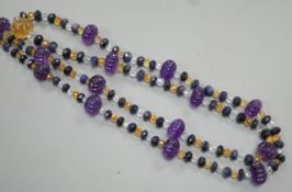 A modern single strand fluted amethyst and facet cut sapphire, citrine and aquamarine bead set