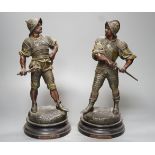 A pair of late Victorian bronzed spelter figures of 17th century soldiers - 33cm high