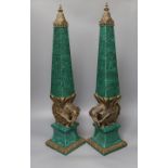 A decorative pair of faux malachite ‘elephant’ obelisks 65cm tall