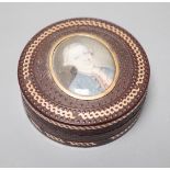 A 19th century pressed bois durci and gilt metal snuff box with painted miniature portrait of a