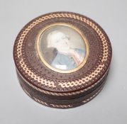 A 19th century pressed bois durci and gilt metal snuff box with painted miniature portrait of a