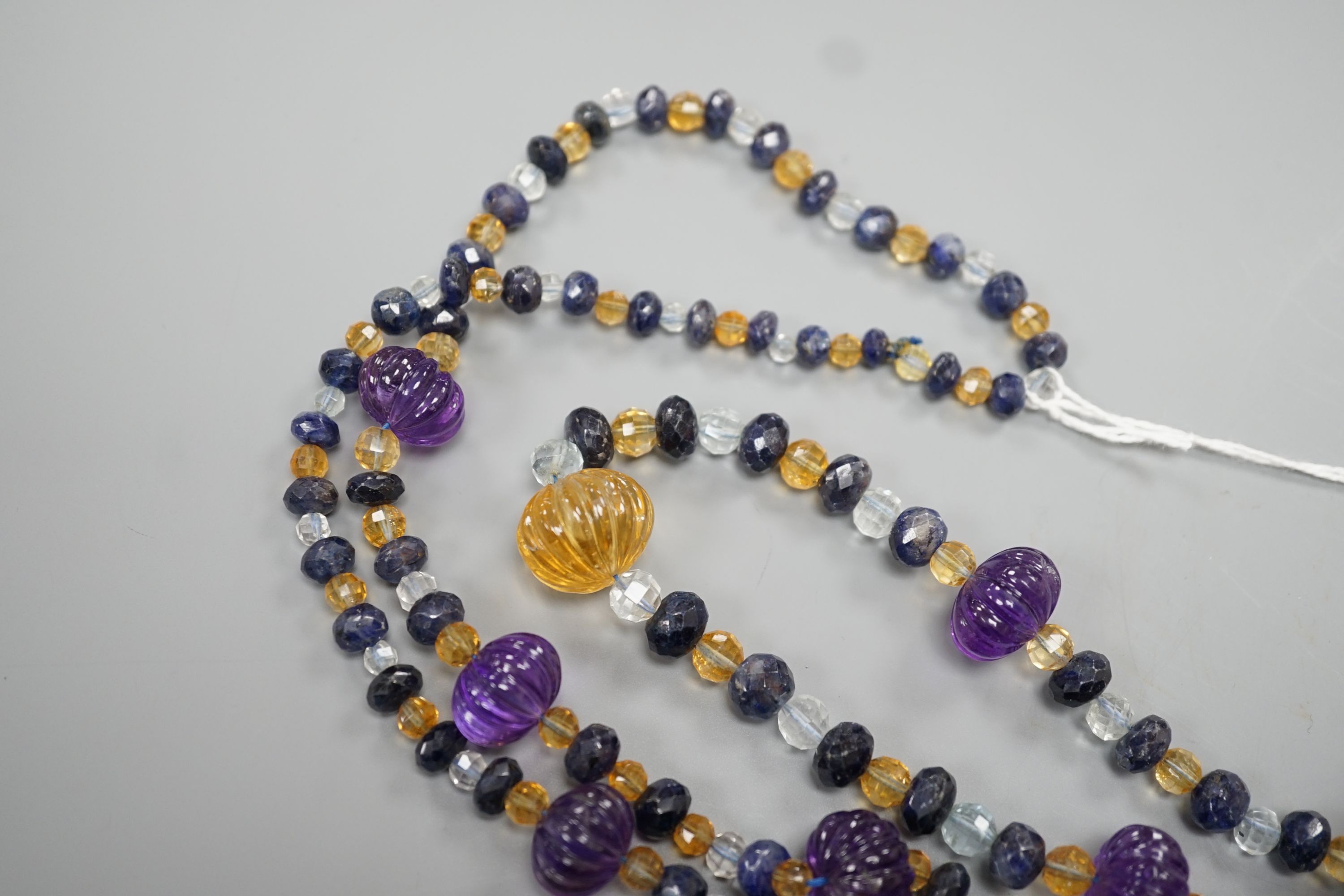 A modern single strand fluted amethyst and facet cut sapphire, citrine and aquamarine bead set - Image 4 of 4