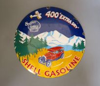 A circular shell gasoline enamel advertising sign - 29cm diameter