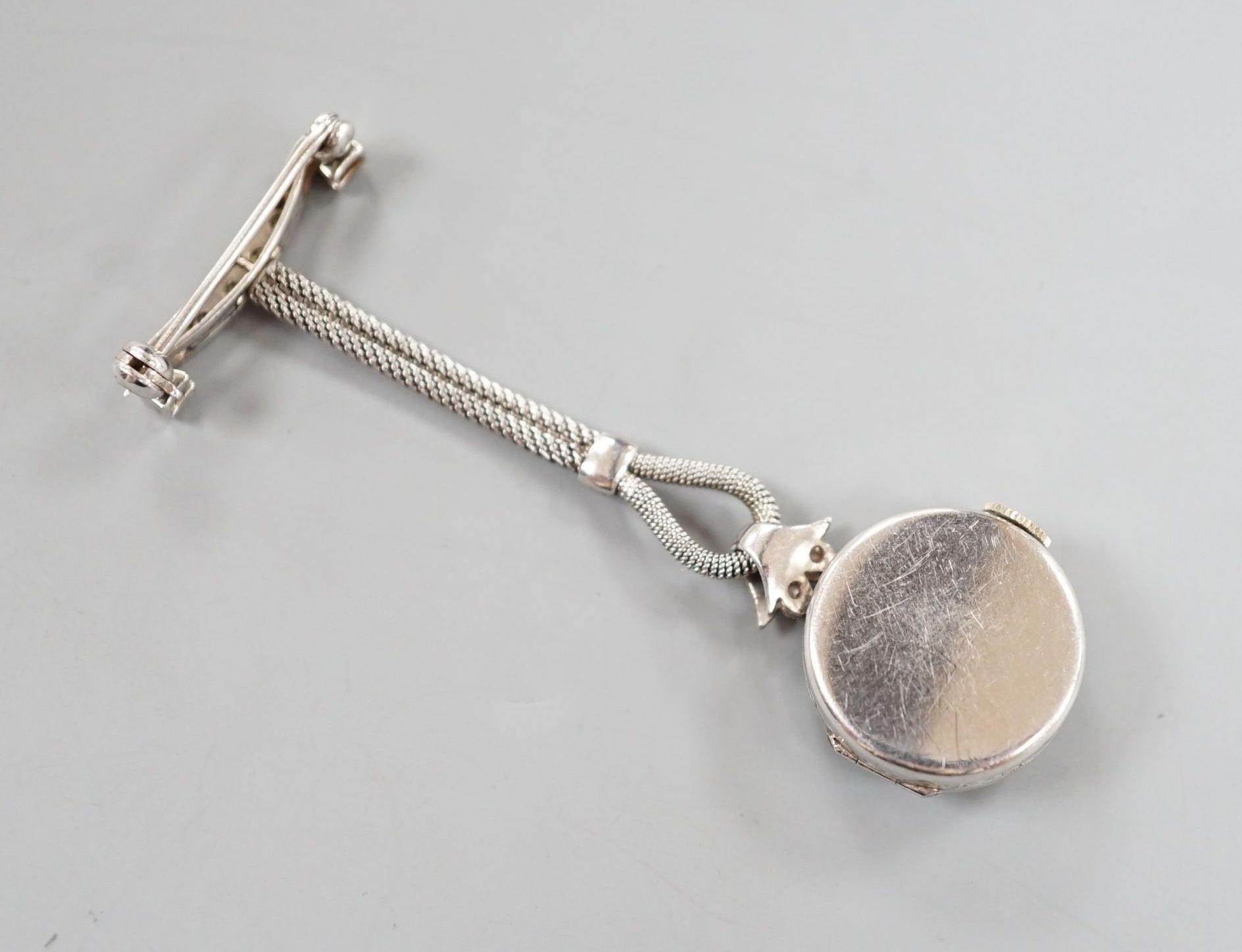 A lady's 1920's white metal (stamped platinum) and diamond chip set lapel watch, 6cm, gross weight - Image 4 of 4