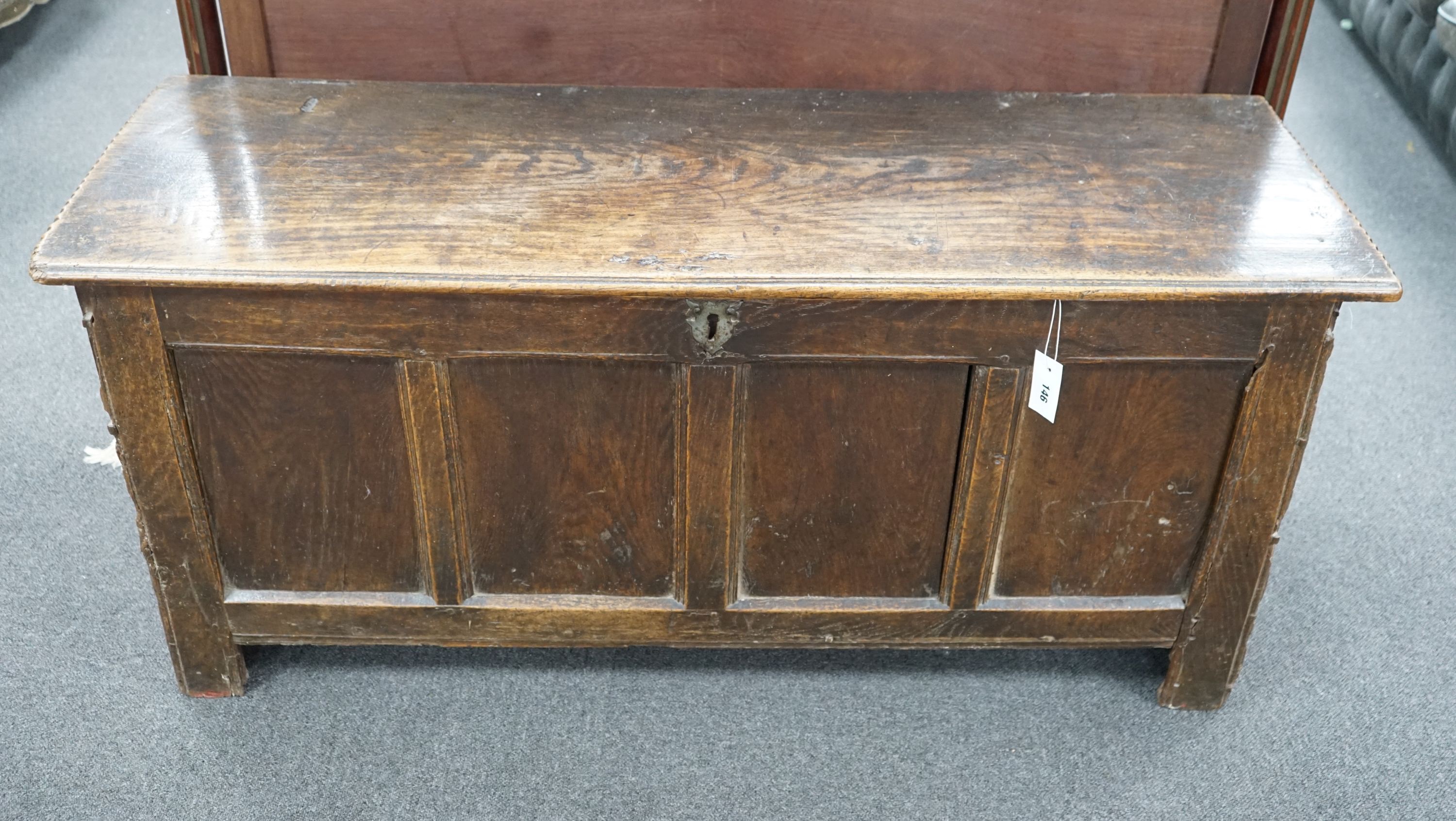 An 18th century panelled oak coffer, length 133cm, depth 46cm, height 59cm