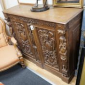 A late 19th / early 20th century Flemish carved oak cabinet section with drawer and pigeon hole
