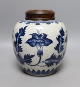 A 19th century Chinese blue and white jar and wood cover - 22cm high