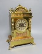 A late Victorian copper and brass mantel clock - 39cm tall