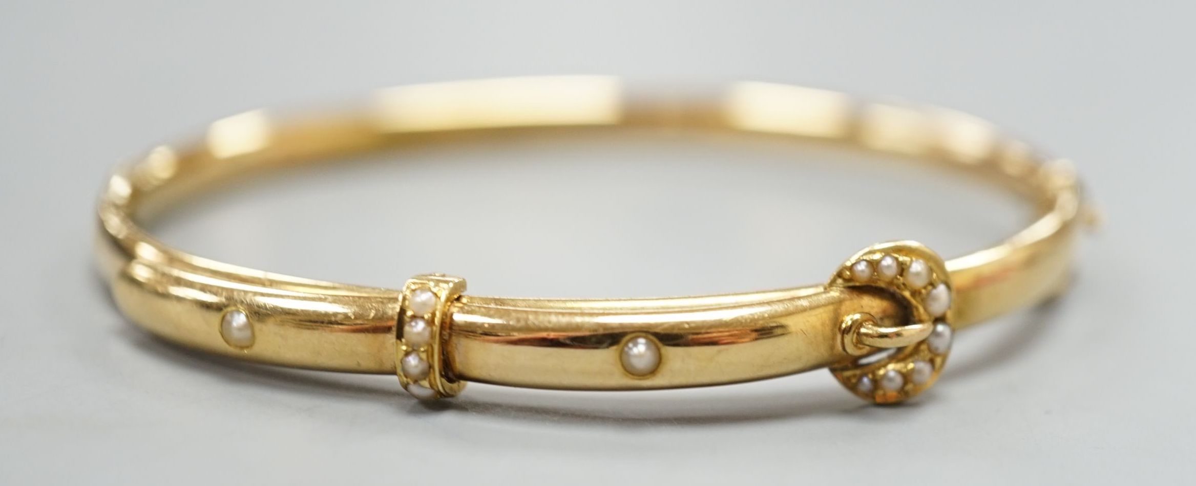 An Edwardian 15ct gold and seed pearl set hinged bracelet, interior diameter 58mm, gross weight 8. - Image 2 of 3