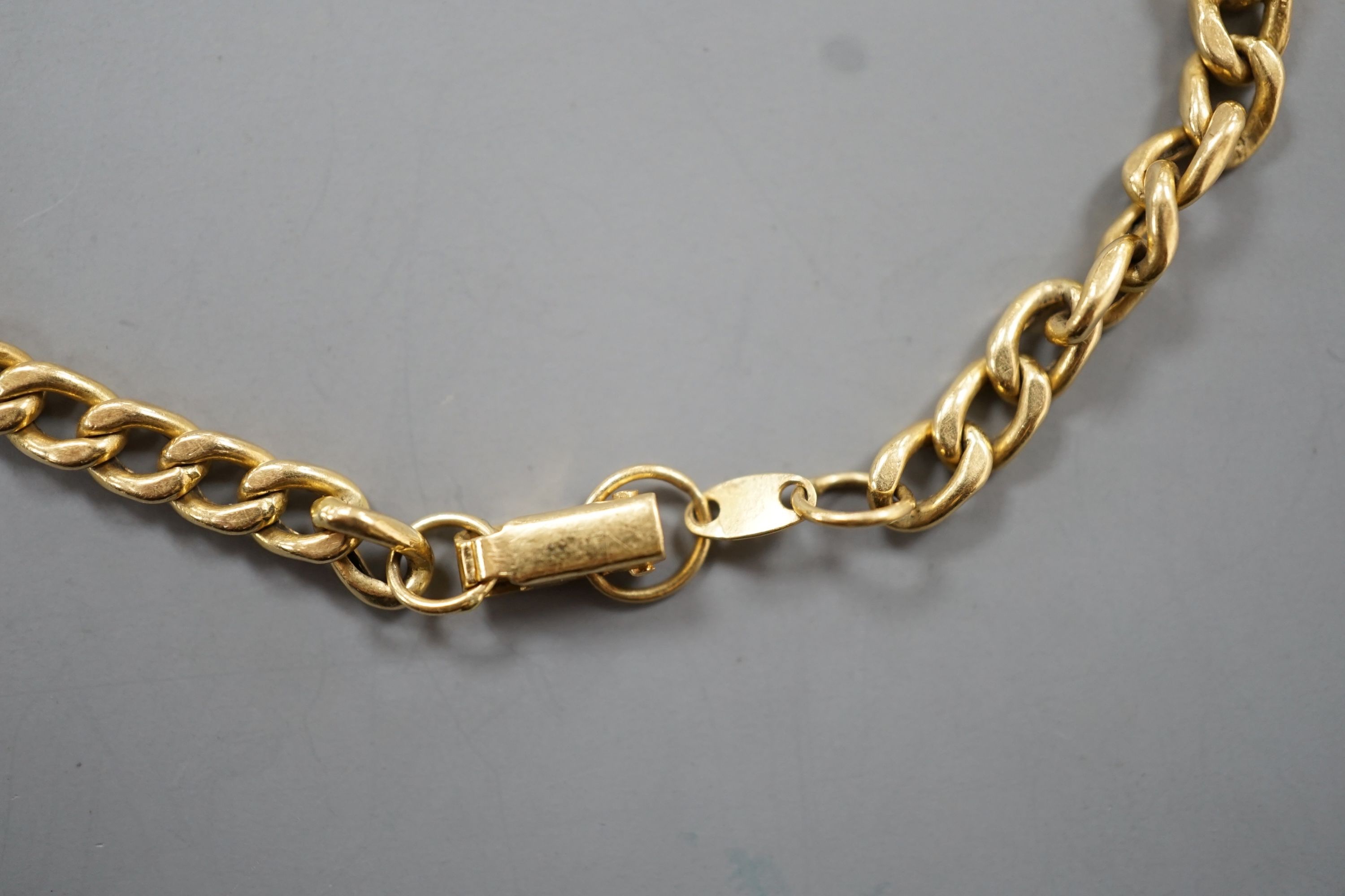 A yellow metal and blue cabochon stone set curb link bracelet, 18cm, gross weight 9 grams. - Image 2 of 4