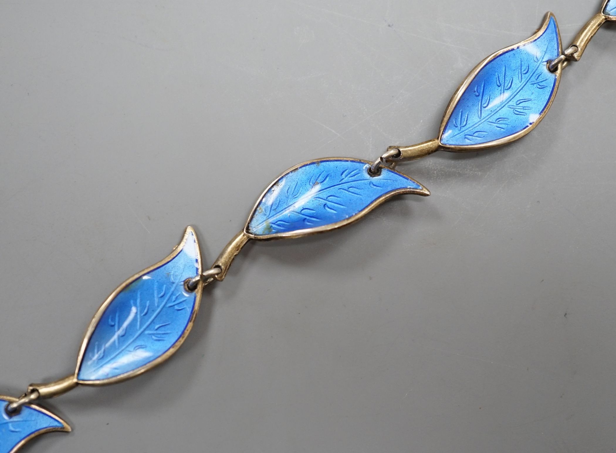 A Norwegian 925 gilt white metal and blue enamel leaf link bracelet by David Andersen, 17cm.