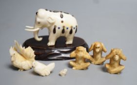 A Japanese Ivory and Shibayama style model of an elephant, three Japanese Ivory figures of the three