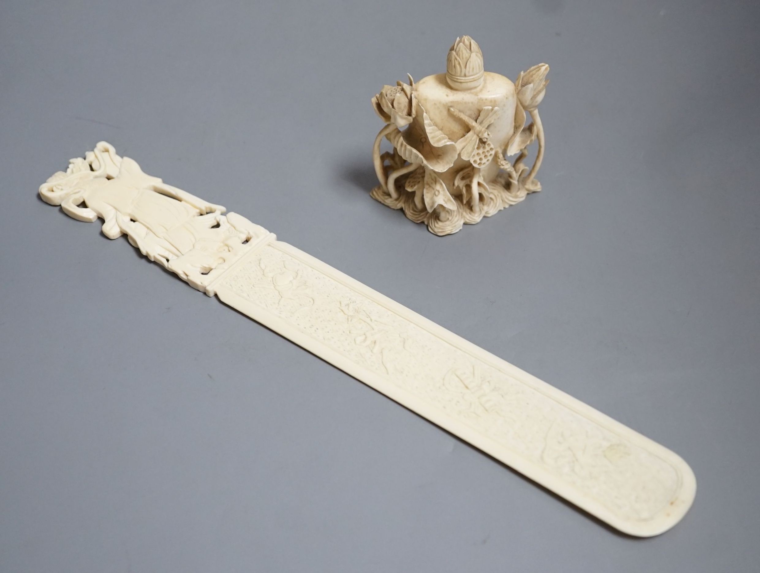 An early 20th century Chinese carved ivory page turner together with a similar carved ivory ‘