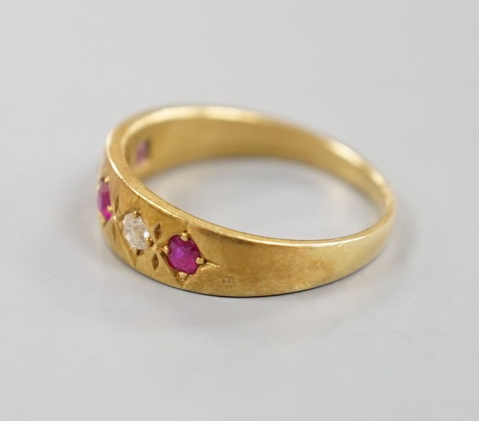 An early 20th century yellow metal and gypsy set three ruby and two stone diamond ring, size P, - Image 2 of 4