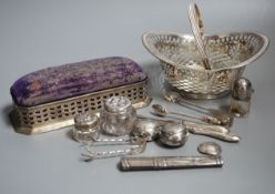 Small silver including two pill boxes, a silver mounted pin cushion, a sterling bonbon basket, etc.