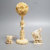 A Chinese ivory concentric puzzle ball and stand, two Chinese ivory snuff bottles and stoppers,