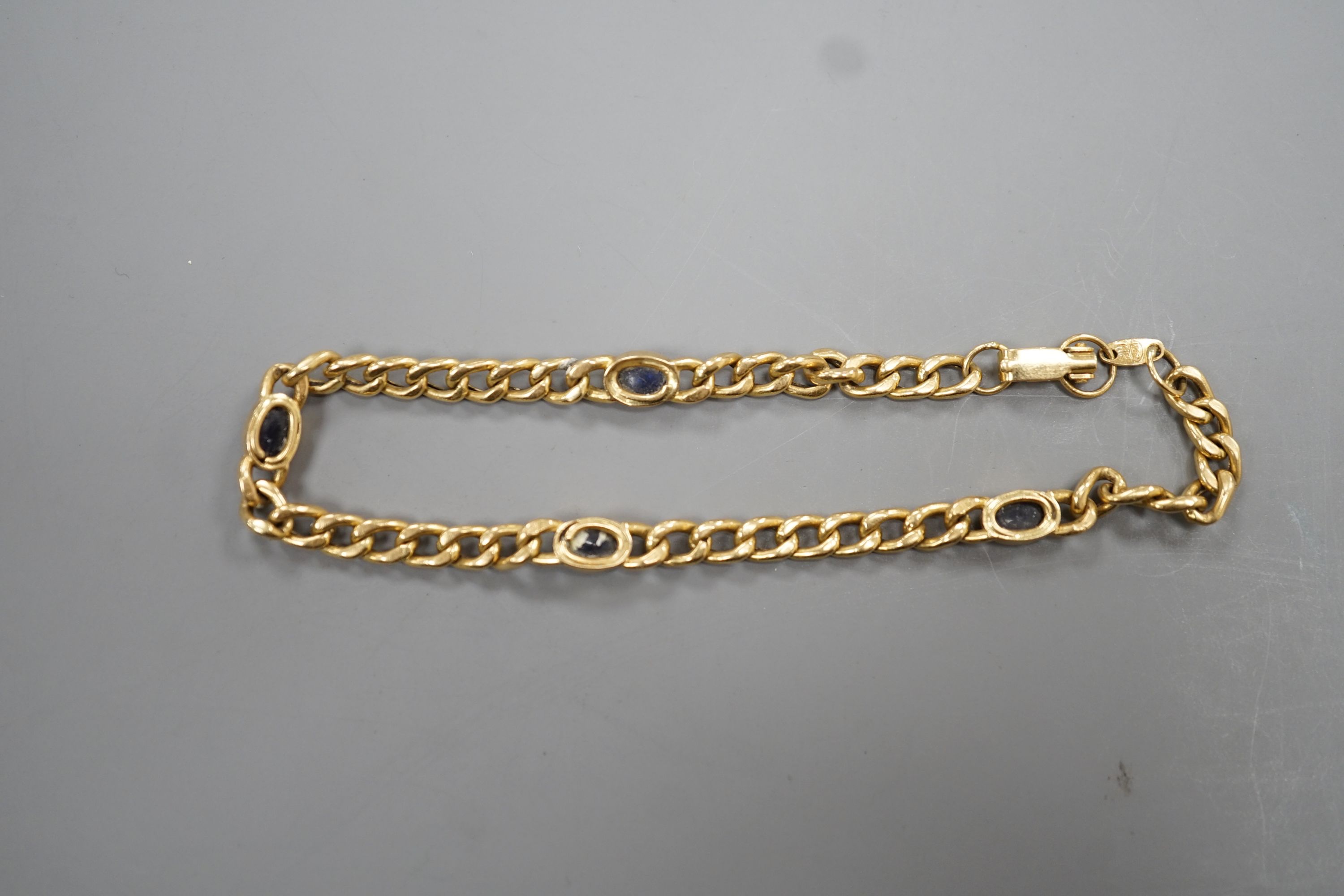 A yellow metal and blue cabochon stone set curb link bracelet, 18cm, gross weight 9 grams. - Image 3 of 4