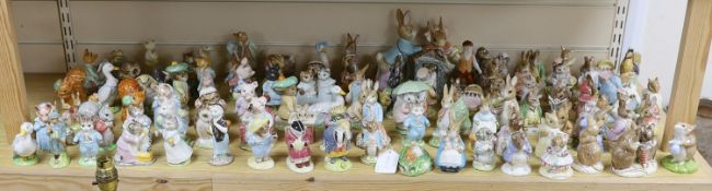 A large collection of Beatrix Potter ceramic figures by Royal Doulton, Beswick and Royal Albert,