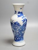 A late 19th century Chinese blue and white baluster vase, painted with birds amid flowers and rock