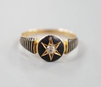 A late Victorian yellow metal, black enamel and diamond set mourning ring, the interior shank with