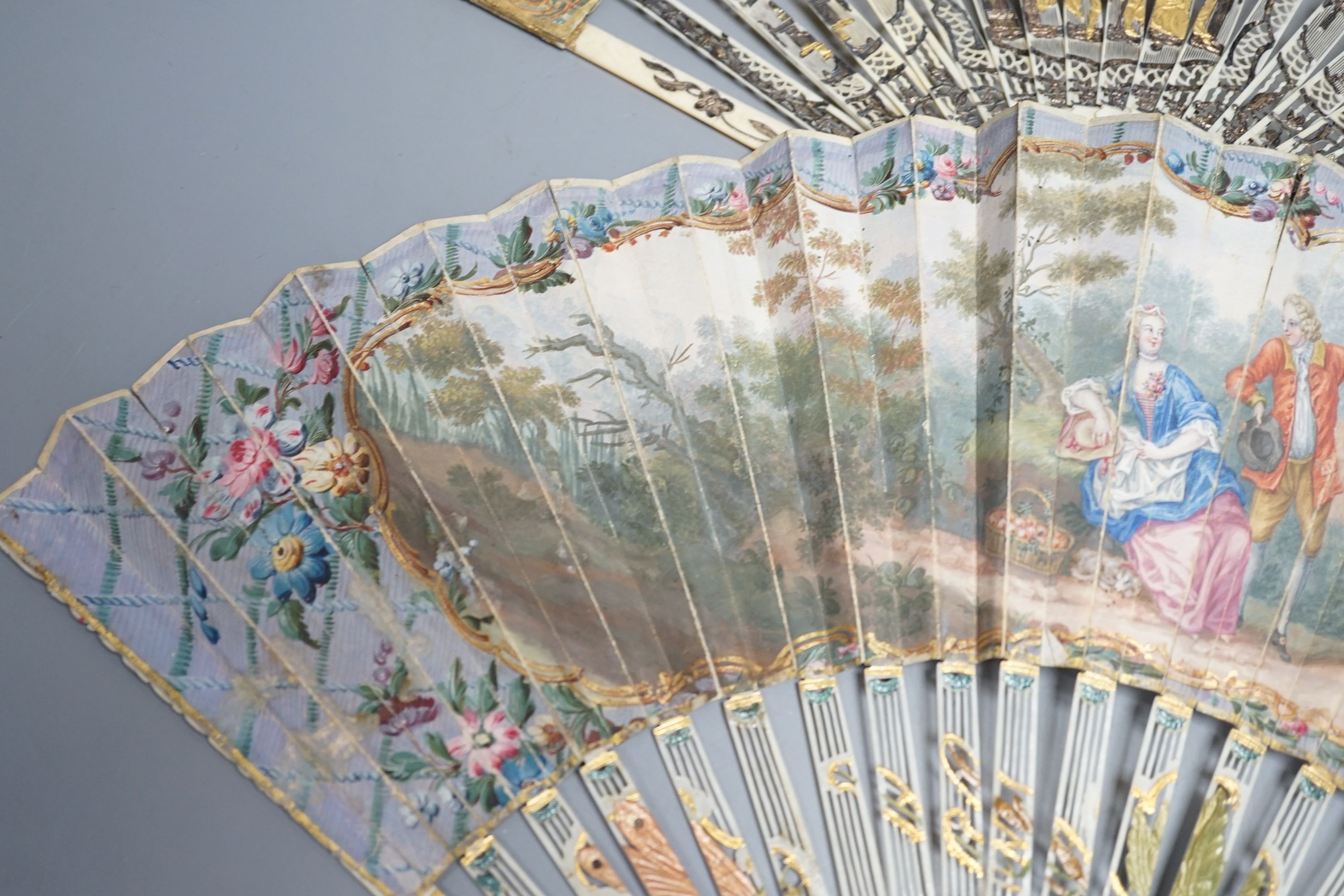 Two late 18th/early 19th century French gilded and silvered ivory and painted paper leaf fans - Image 2 of 9